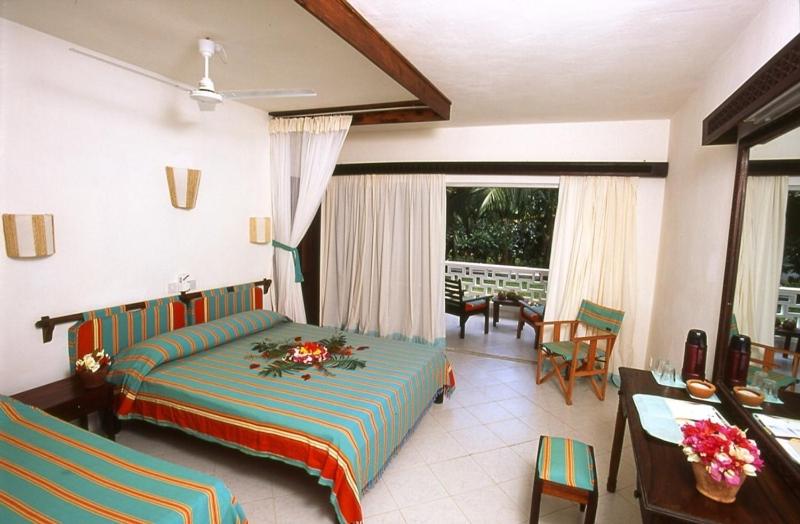 Postel nebo postele na pokoji v ubytování Turtle Bay Beach Club- All Inclusive