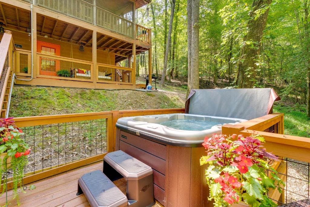 a hot tub on the deck of a house at Secluded Murphy Vacation Rental with Private Hot Tub in Murphy