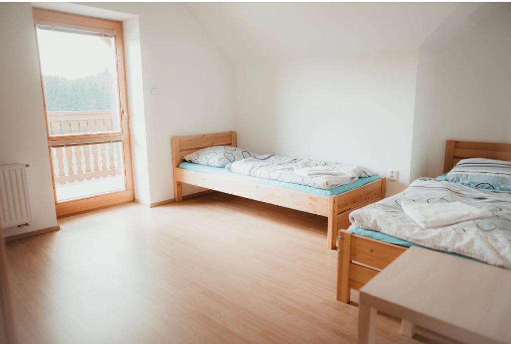 Postel nebo postele na pokoji v ubytování Penzion Na Boučí