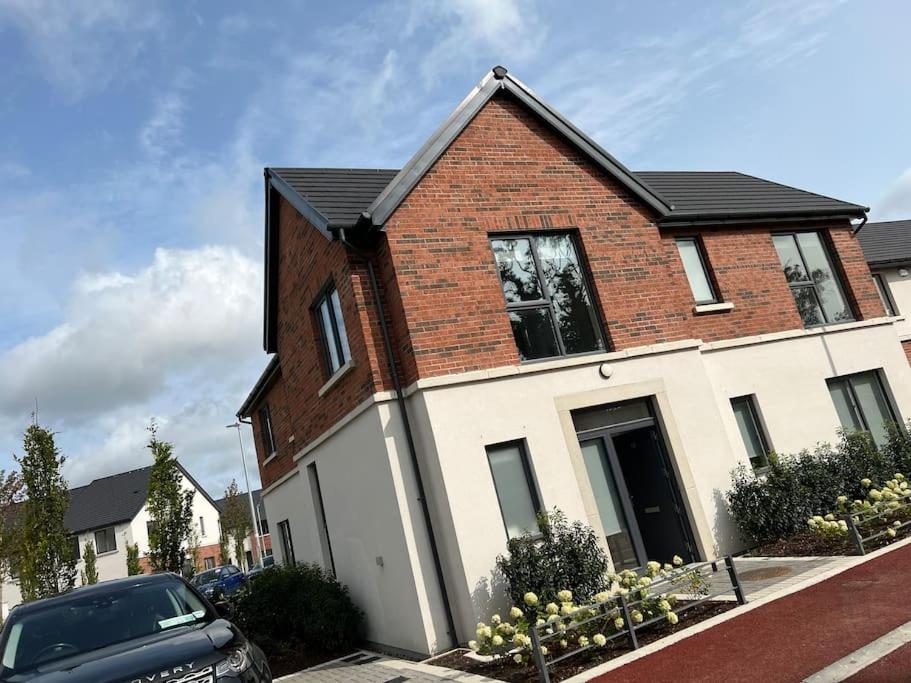 a brick house with a car parked in front of it at 3 bed rooms Vip family house in Dublin