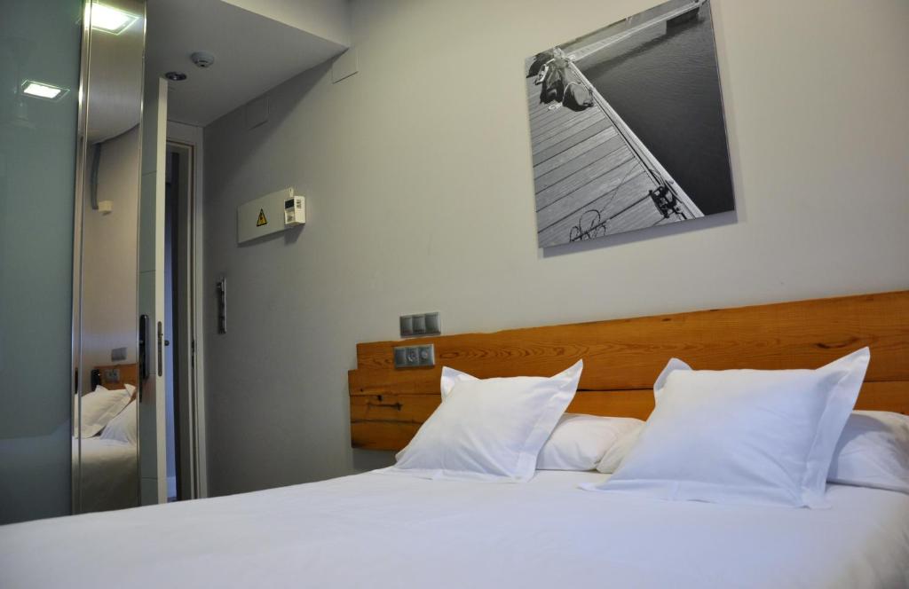 Postel nebo postele na pokoji v ubytování Hosteria Santander