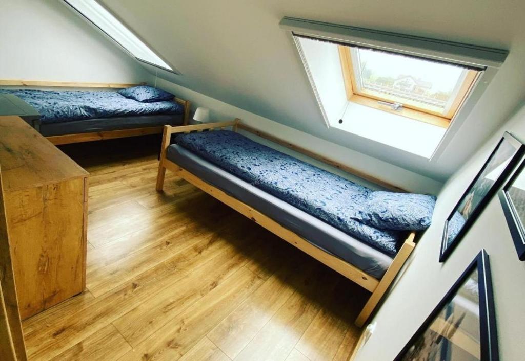 Voodi või voodid majutusasutuse Hotel NOCLEGI WRZOSOWA Siedlce toas