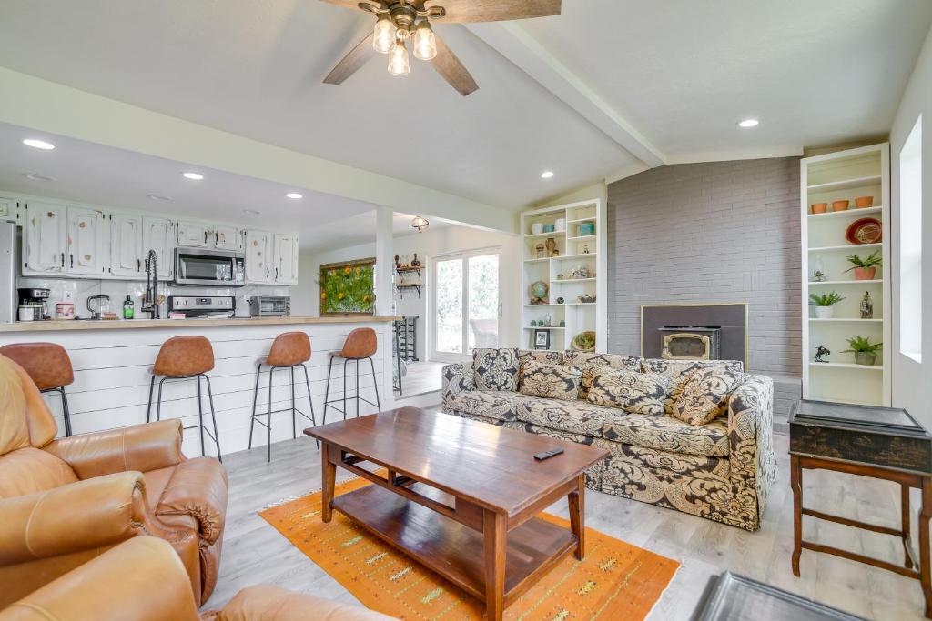 a living room with a couch and a table at Tranquil Edgewood Retreat with Patio and Grill! in Edgewood