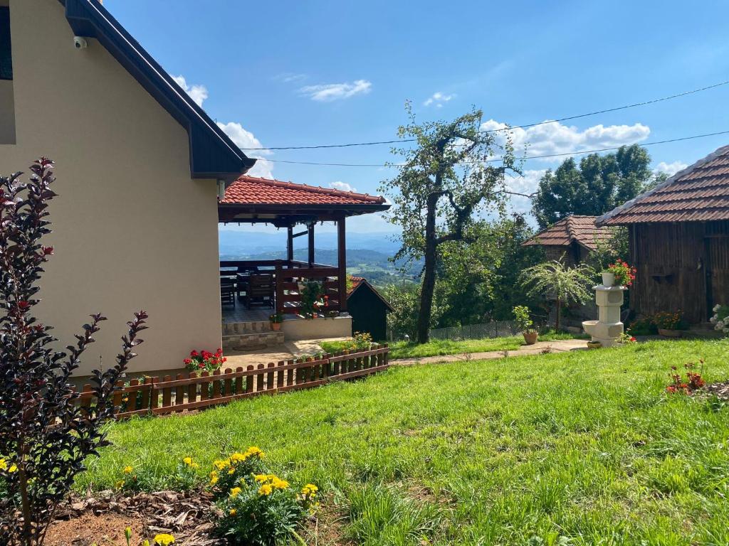 a house with a gazebo in a yard at La Casa Garasa in Čačak