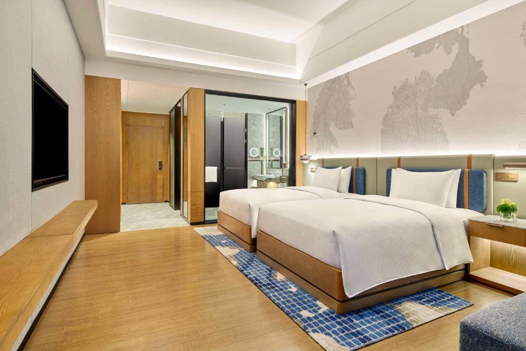 Postel nebo postele na pokoji v ubytování DoubleTree by Hilton Guangzhou Zengcheng
