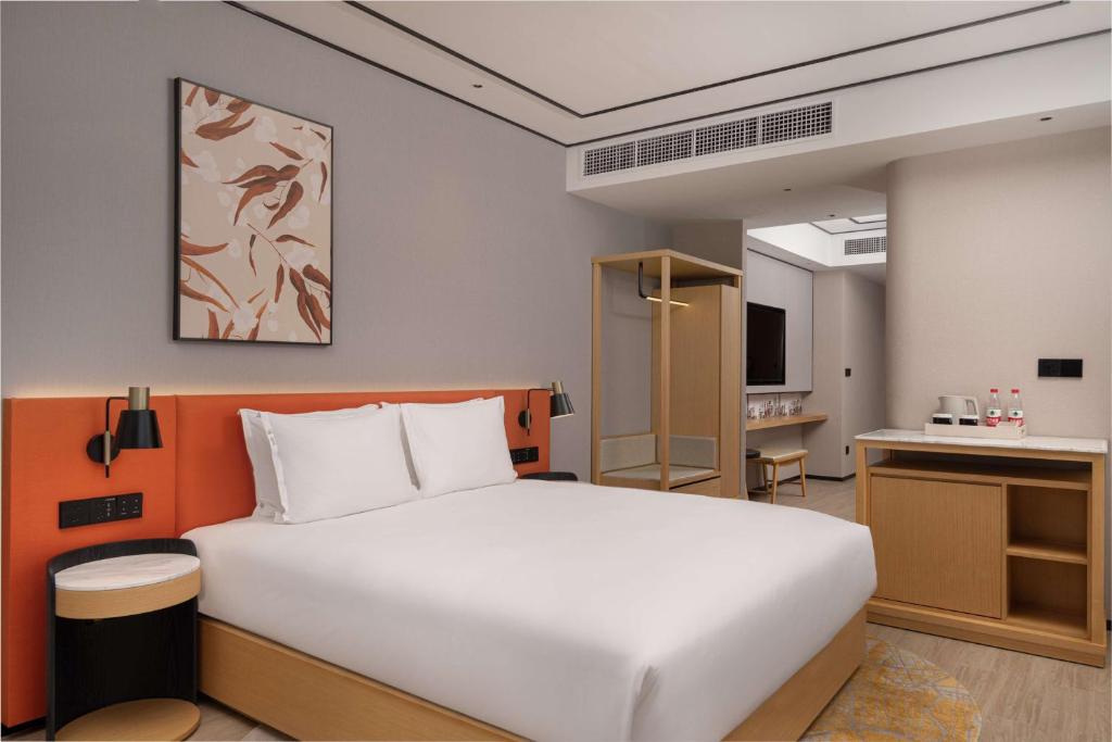 Postel nebo postele na pokoji v ubytování Hilton Garden Inn Shanghai Lujiazui