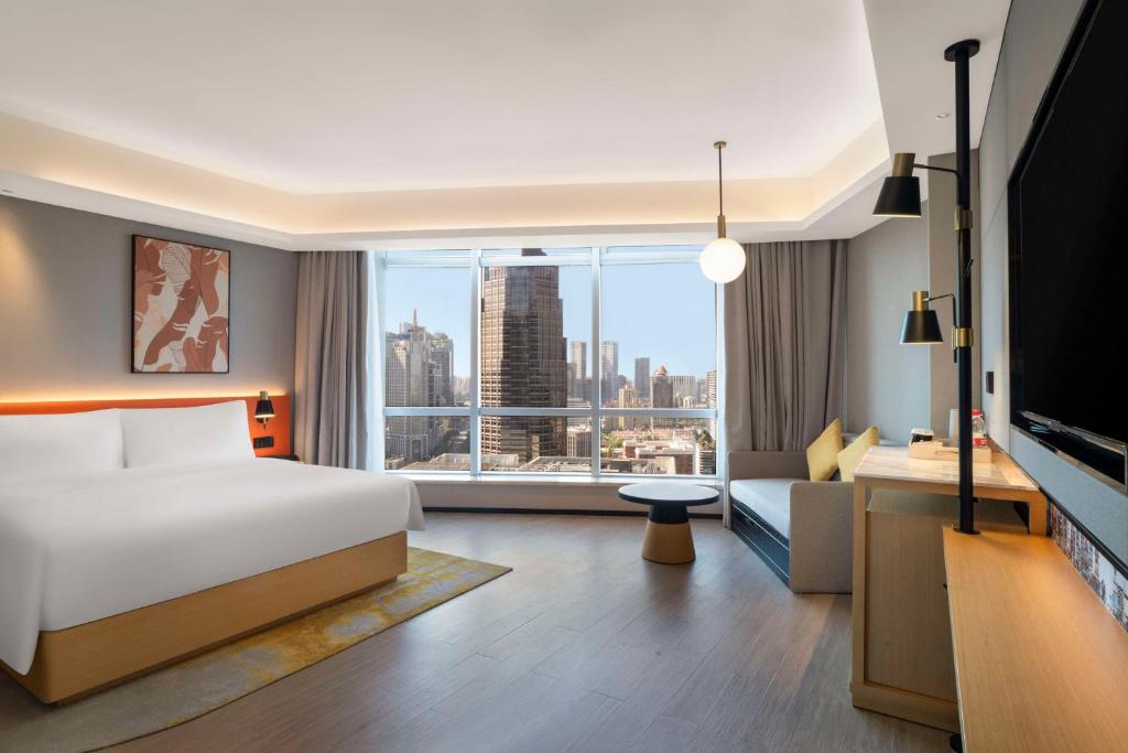 TV a/nebo společenská místnost v ubytování Hilton Garden Inn Shanghai Lujiazui