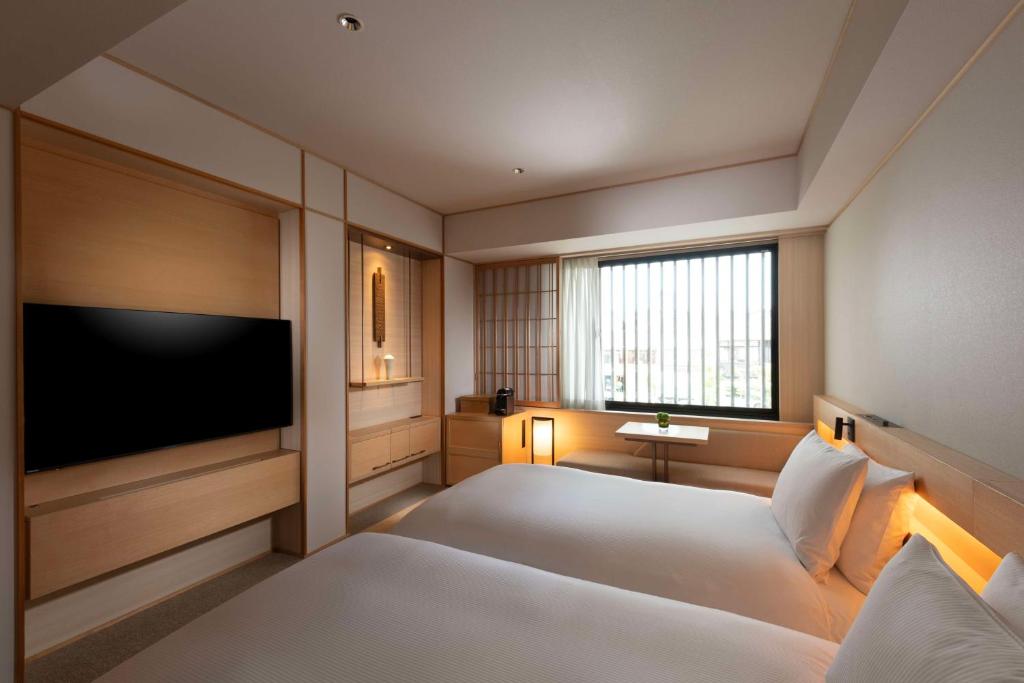 Postel nebo postele na pokoji v ubytování DoubleTree by Hilton Kyoto Higashiyama