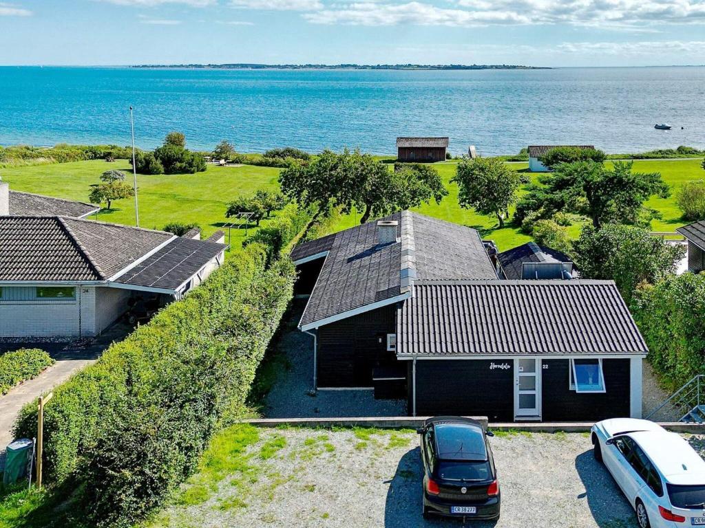 a house with a car parked in front of it at 6 person holiday home in Faaborg-By Traum in Fåborg