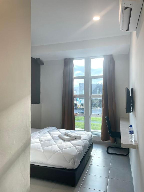 Postel nebo postele na pokoji v ubytování Garden Inns Motel