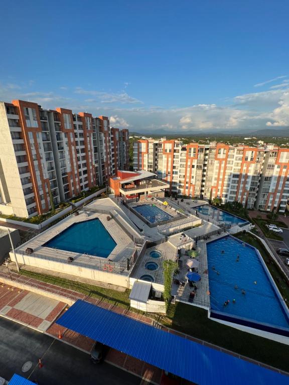 an overhead view of two swimming pools in a city at Apartamento Cómodo en Girardot Cundinamarca in Girardot