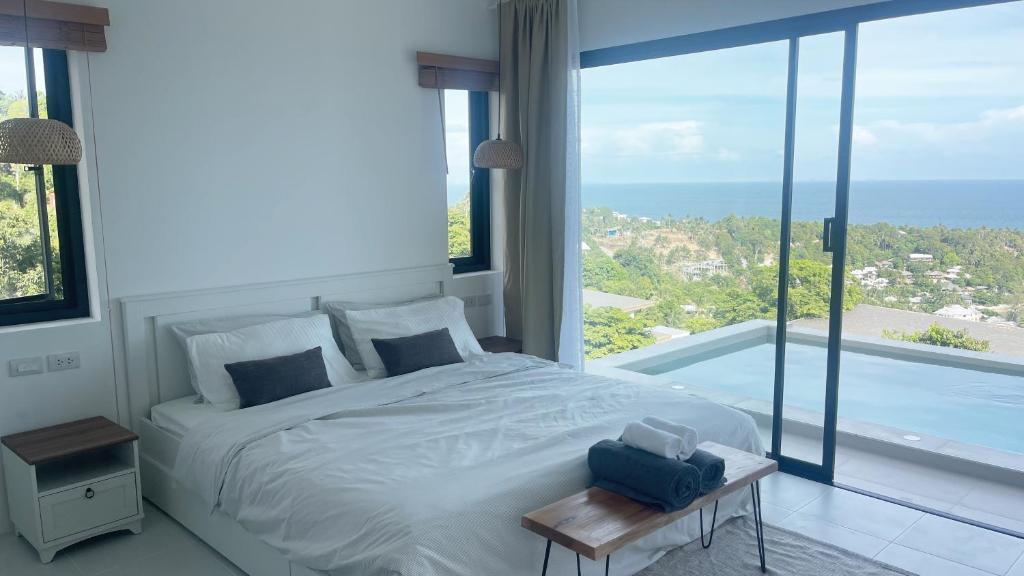 Postel nebo postele na pokoji v ubytování Infinity Villa