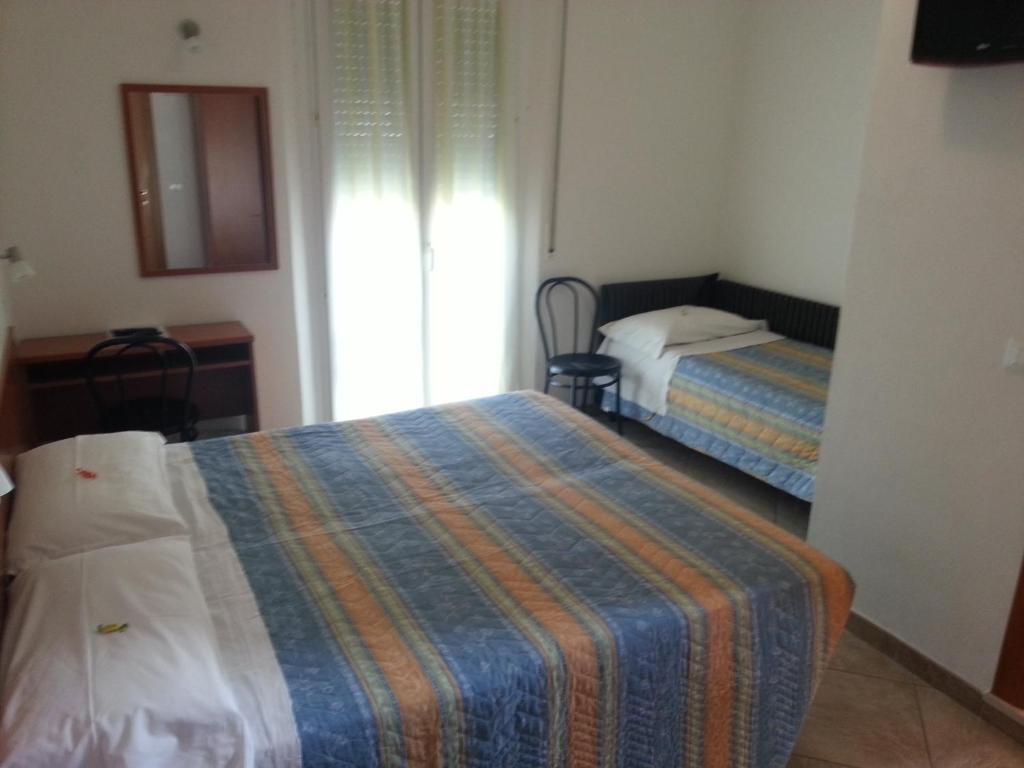 Postel nebo postele na pokoji v ubytování Hotel Trinidad