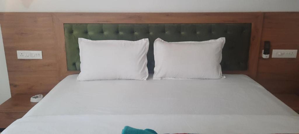 Postel nebo postele na pokoji v ubytování Eve Resort