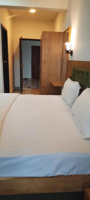 Postel nebo postele na pokoji v ubytování Eve Resort