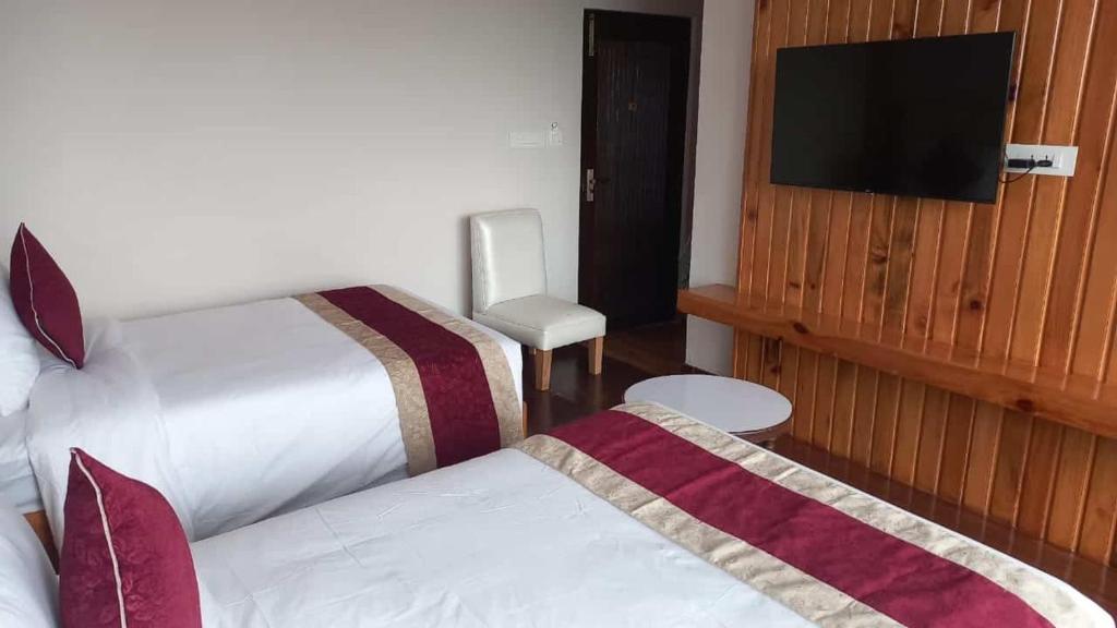 Voodi või voodid majutusasutuse Hotel Smarak toas