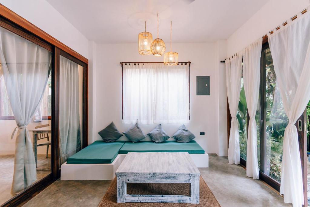 Postel nebo postele na pokoji v ubytování Katmon Villas
