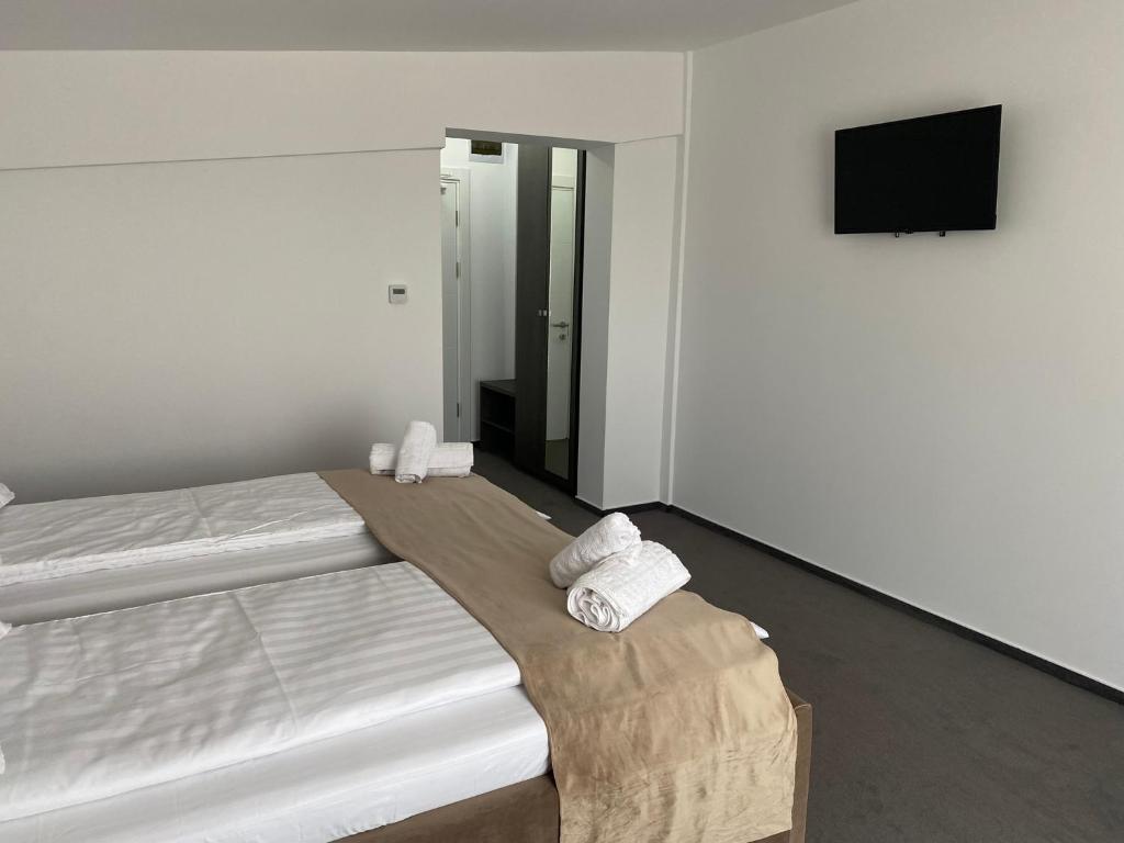 Postel nebo postele na pokoji v ubytování Hotel Maya