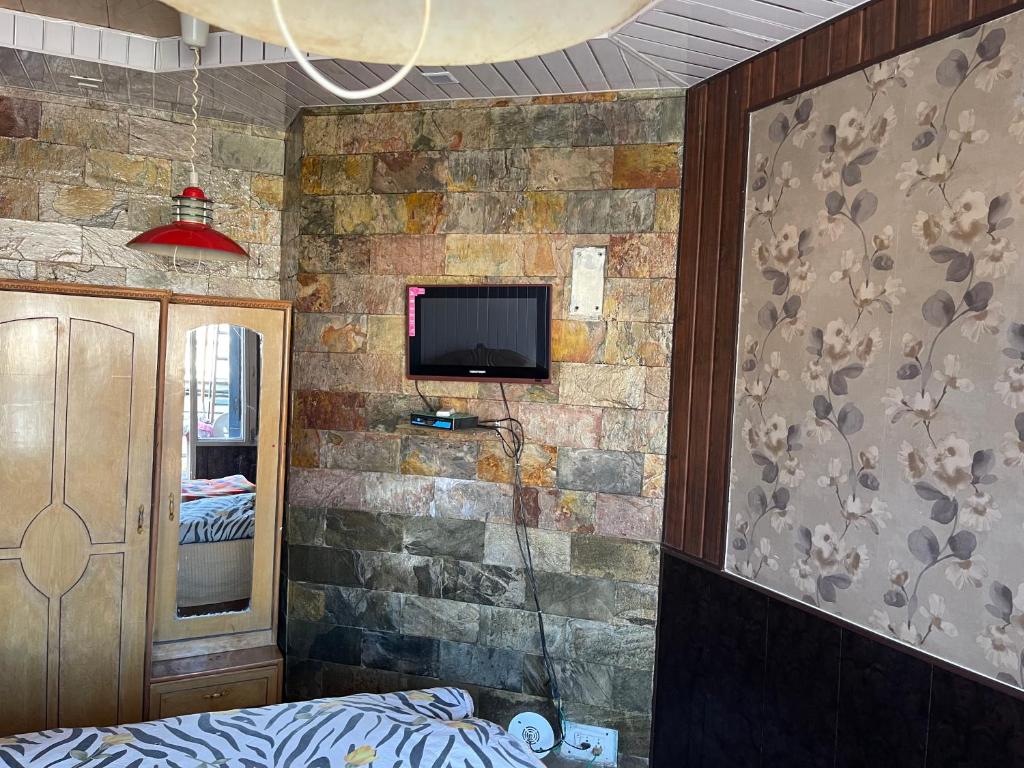 TV a/nebo společenská místnost v ubytování Hotel Tip Top