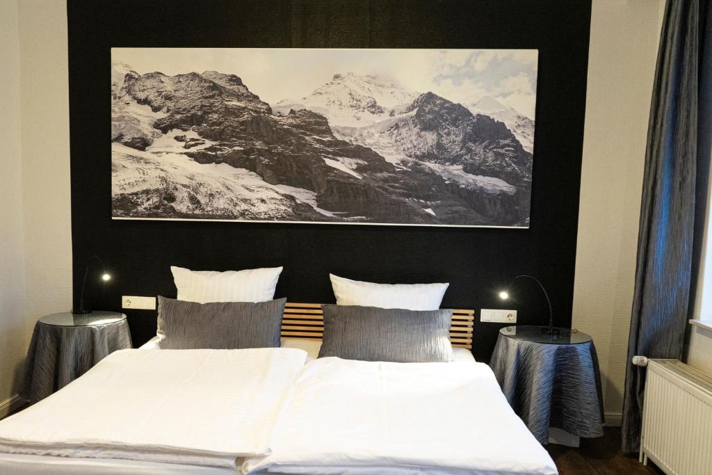 Postel nebo postele na pokoji v ubytování Rein Klassik Hotel