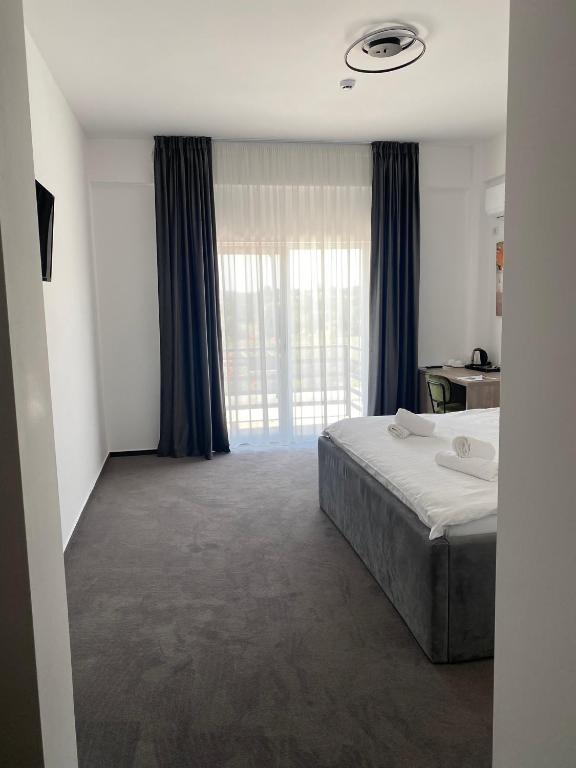 Postel nebo postele na pokoji v ubytování Hotel Maya