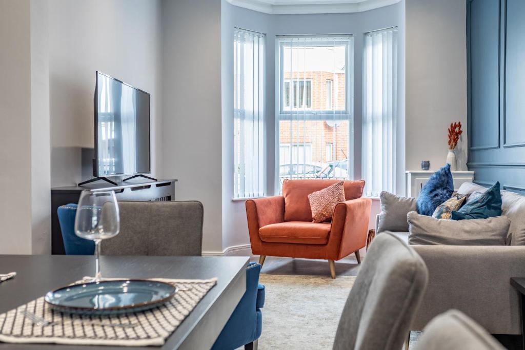a living room with a couch and a table at Luxury Edwardian Townhouse in Belfast in Belfast