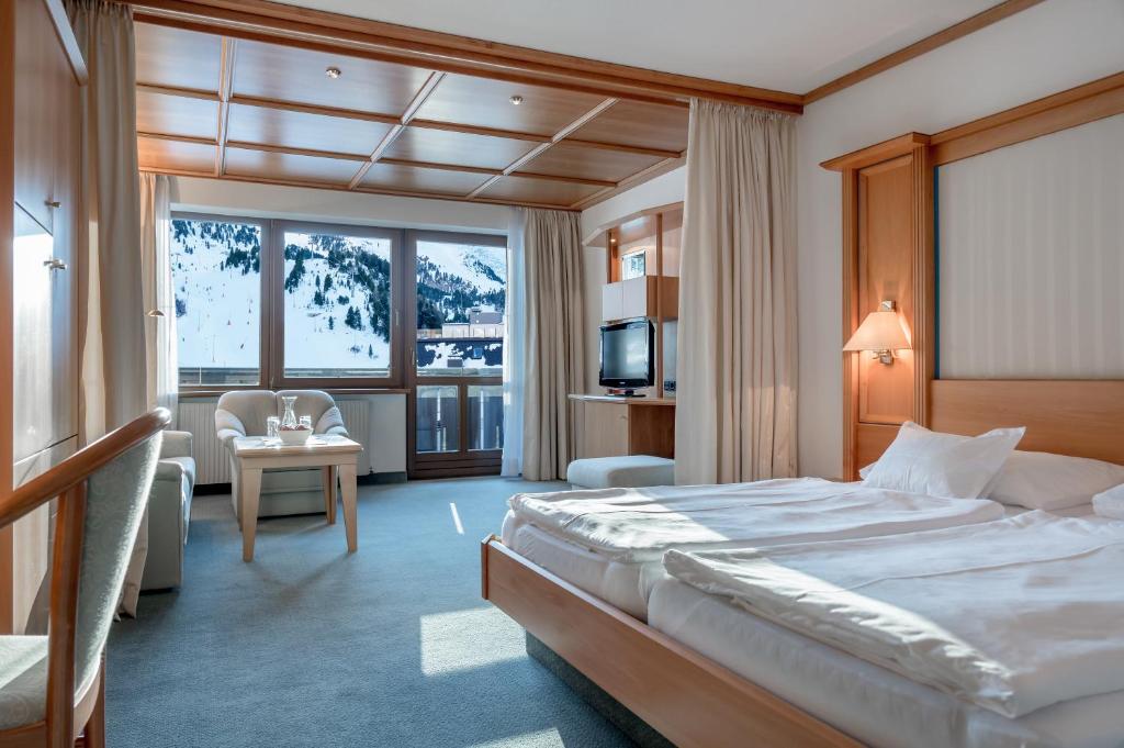Postel nebo postele na pokoji v ubytování Hotel Alpina deluxe