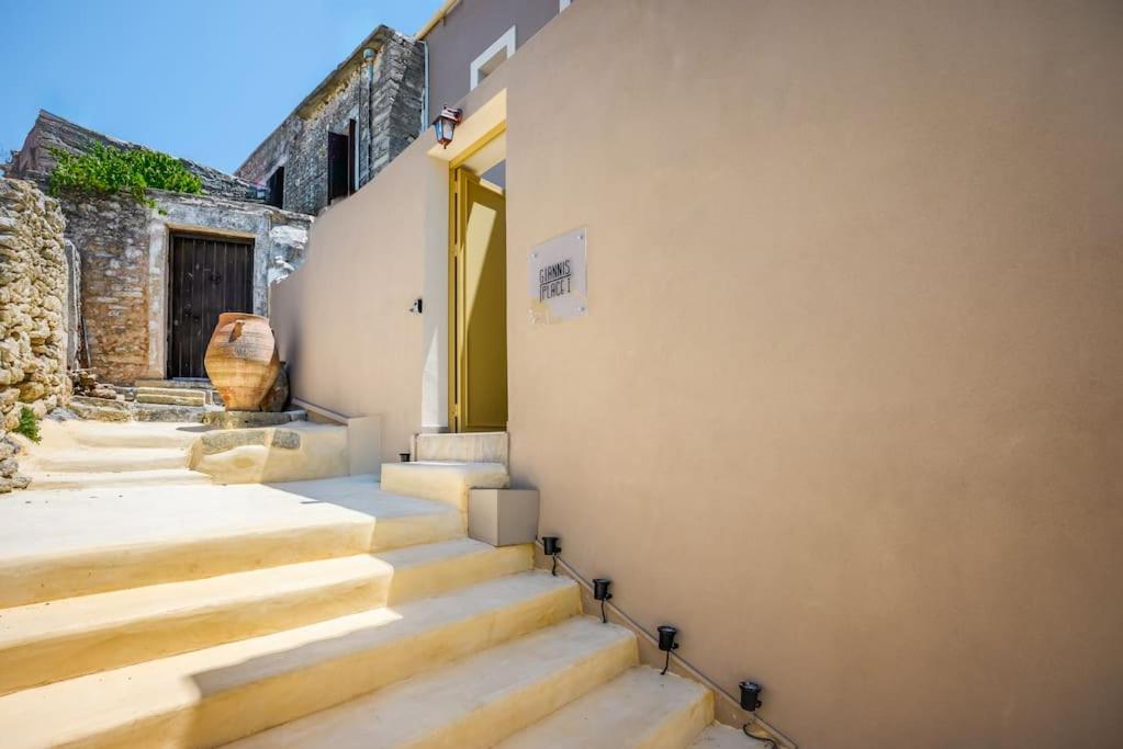 a set of stairs leading up to a building at Giannis Place I in Áyios Vasílios