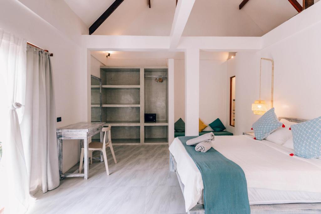 Postel nebo postele na pokoji v ubytování Katmon Villas