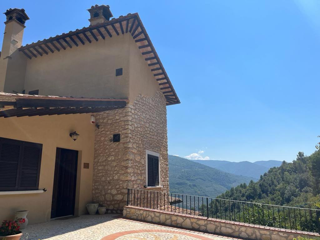 a house with a view of the mountains at Agriturismo Il Casaletto in Montefranco