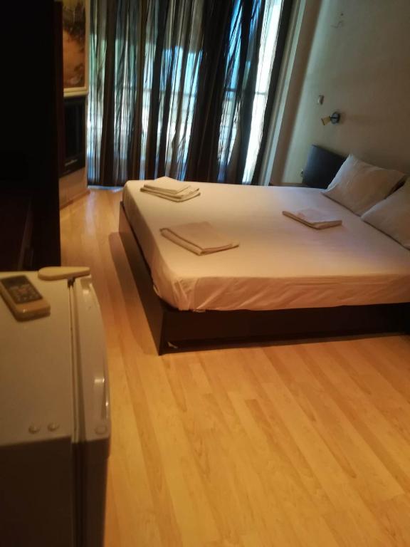 Postel nebo postele na pokoji v ubytování Agathoupoli beach