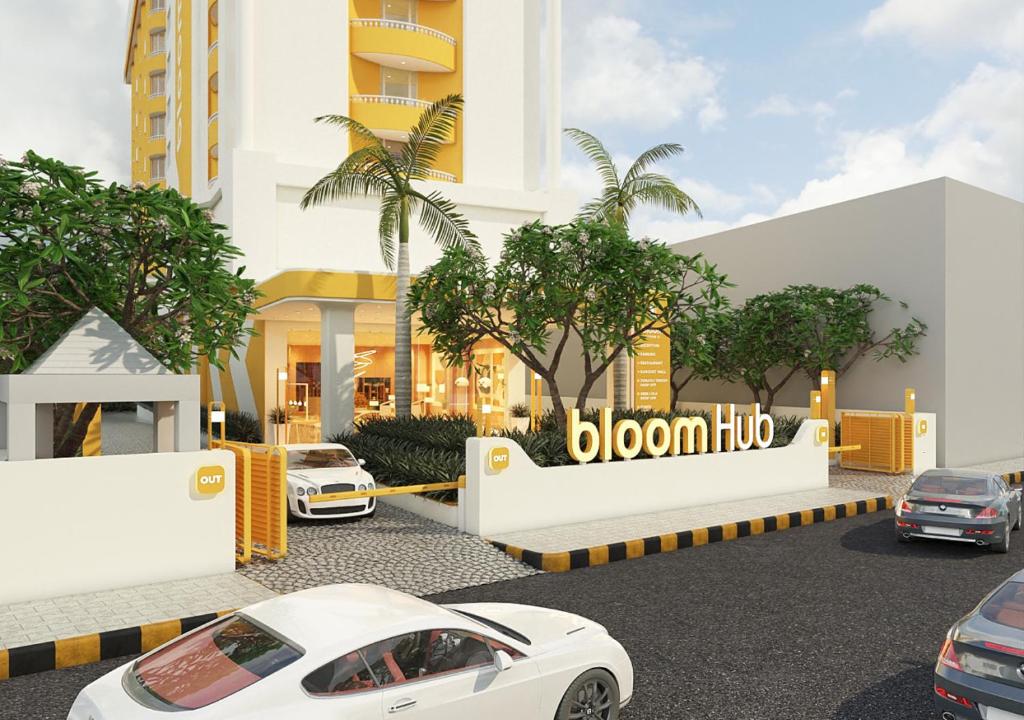 eine Darstellung eines weißen Autos, das vor einem Gebäude geparkt ist in der Unterkunft Bloom Hub Guindy in Chennai