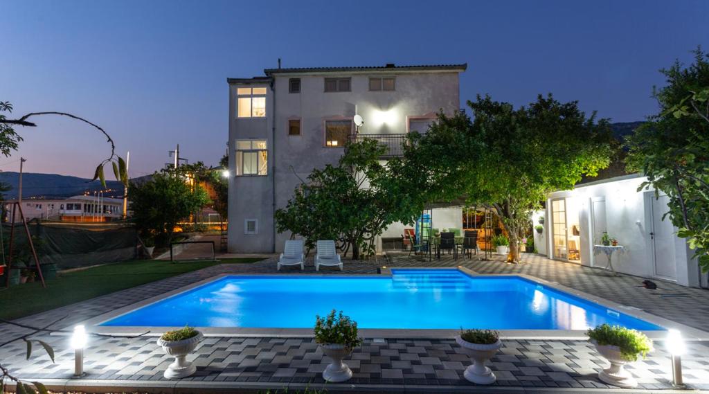 a swimming pool in the backyard of a house at Apartman Blagaj in Blagaj