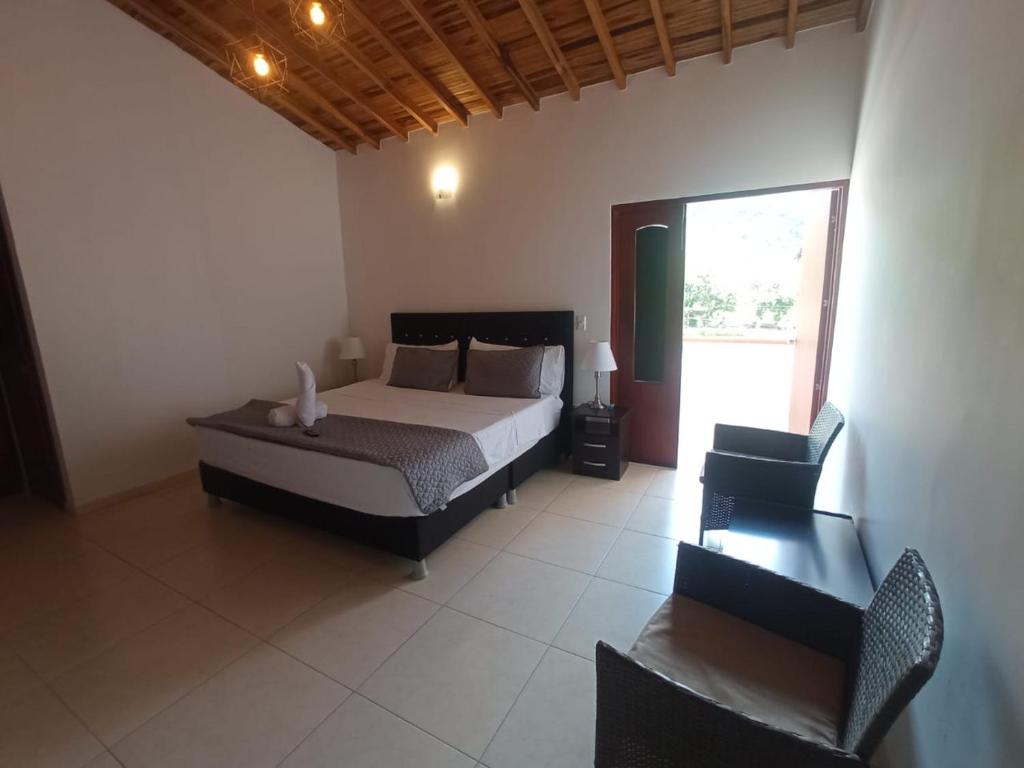 Postel nebo postele na pokoji v ubytování Hotel Resort Campestre Puerta Del Sol - San Gil