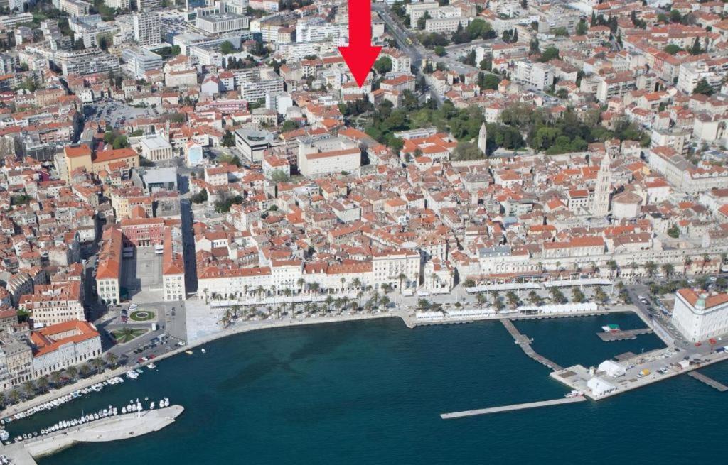 an aerial view of a city with a red arrow at Old Town Historic Core in Split