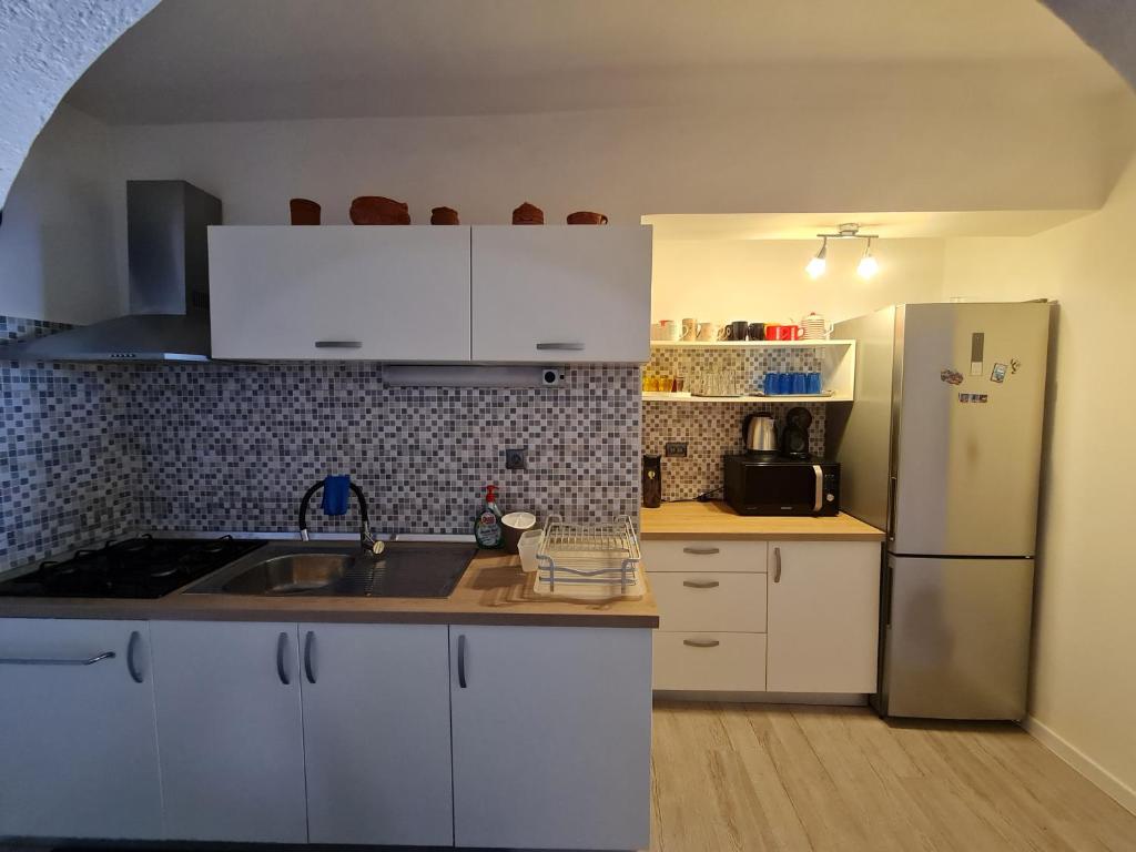 Kuchyň nebo kuchyňský kout v ubytování Apartments Ivan