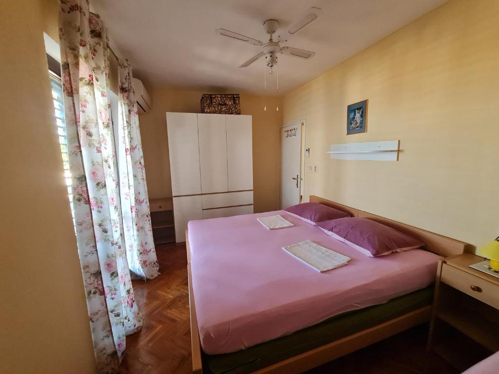 Postel nebo postele na pokoji v ubytování Apartments Ivan