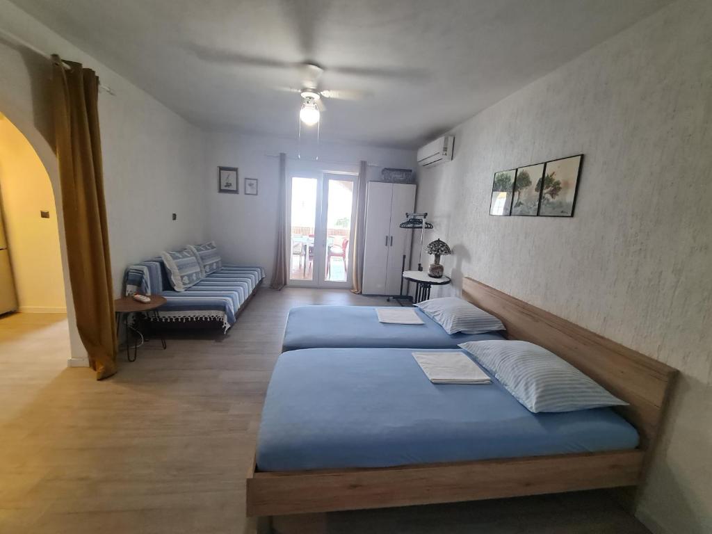 Postel nebo postele na pokoji v ubytování Apartments Ivan