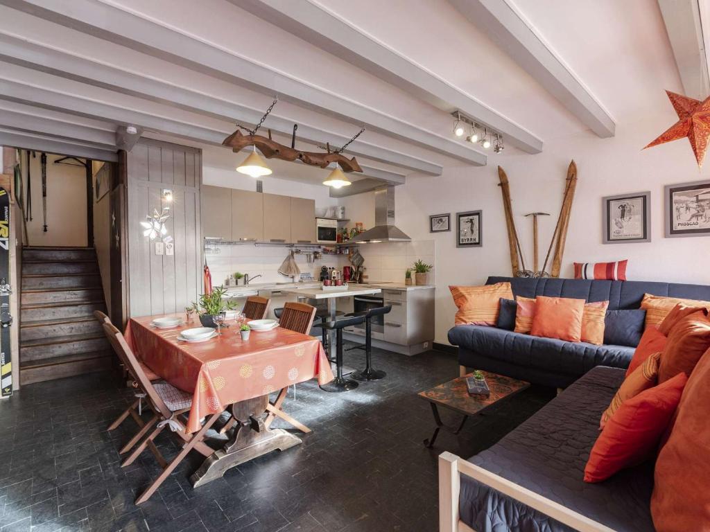 a living room with a table and a couch at Appartement Saint-Lary-Soulan, 3 pièces, 6 personnes - FR-1-296-384 in Saint-Lary-Soulan