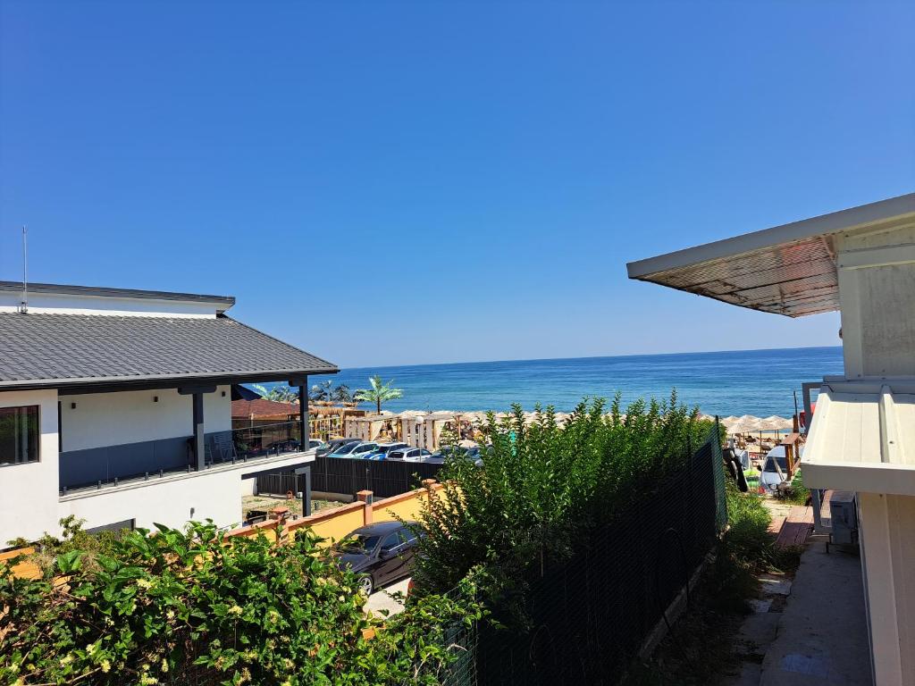 a view of the ocean from a house at Beach House Cabacum in Golden Sands