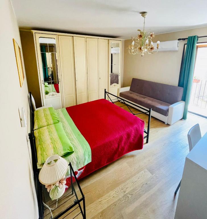 Łóżko lub łóżka w pokoju w obiekcie San Nicolò Holiday Home