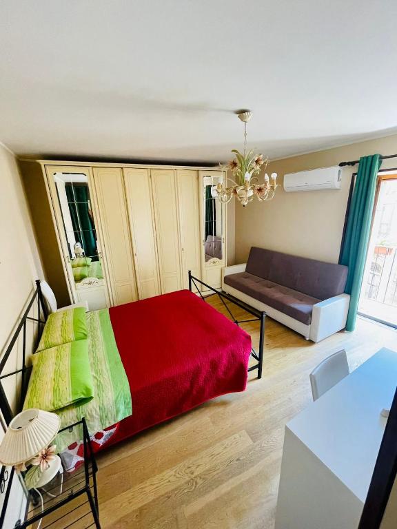 Łóżko lub łóżka w pokoju w obiekcie San Nicolò Holiday Home