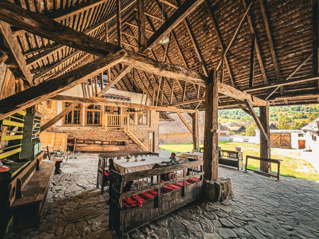 a large room with a table in a building at Castle View in Saschiz