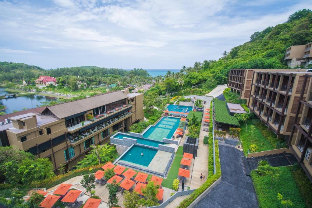 an overhead view of a resort with a swimming pool at Sunsuri Phuket - SHA Plus in Nai Harn Beach