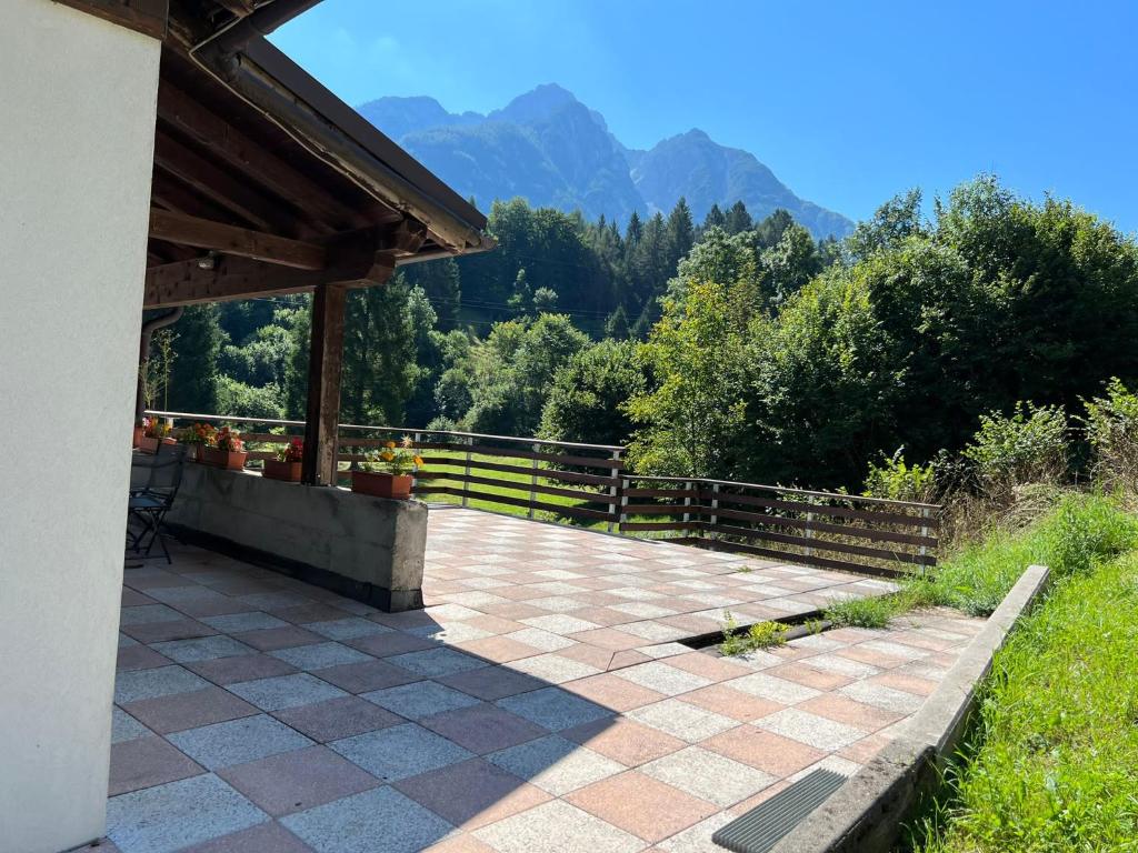 a patio with a view of the mountains at Chalet Francesca in Pieve di Cadore