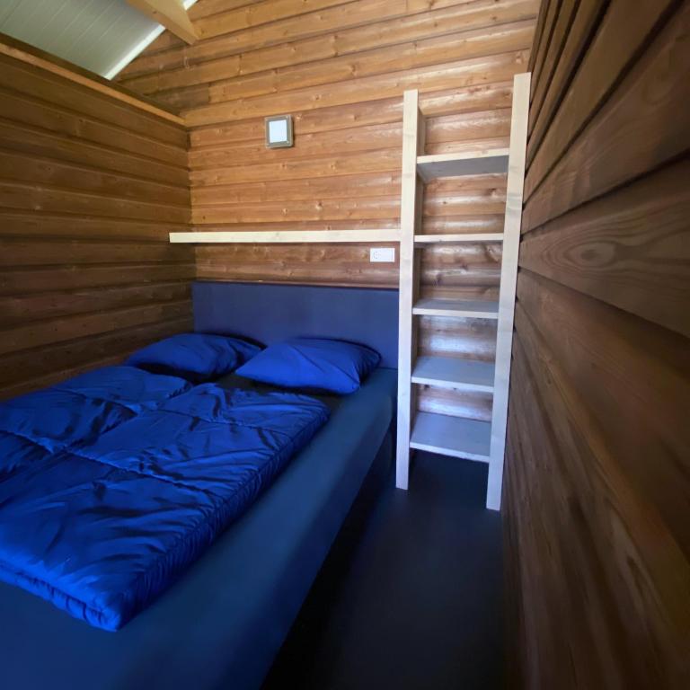 Postel nebo postele na pokoji v ubytování Familie vakantiepark Krieghuusbelten