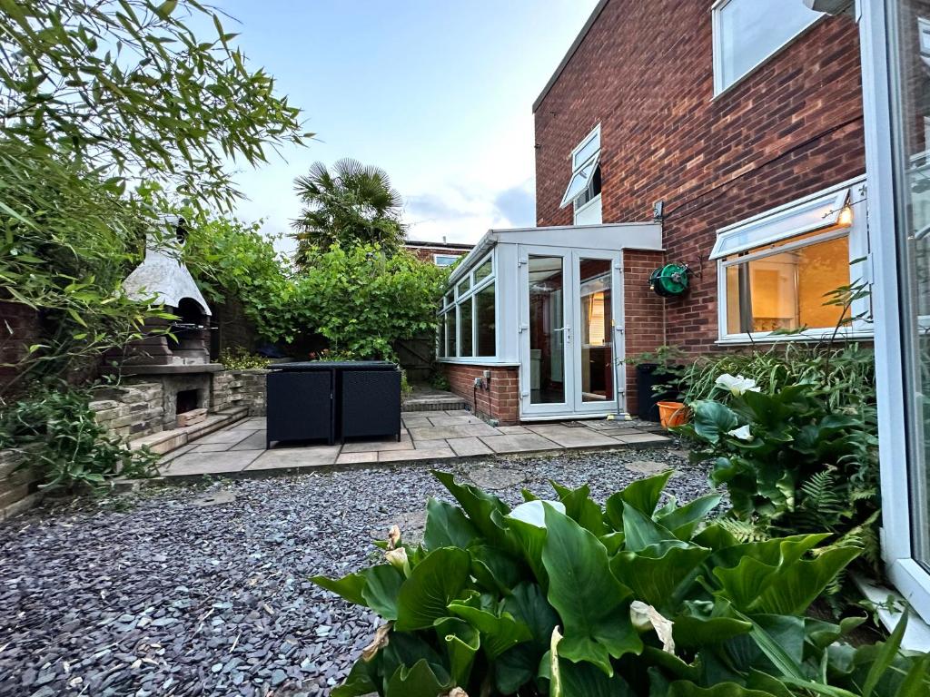 a brick house with a backyard with a gravel yard at Detached house in Essex in Harlow