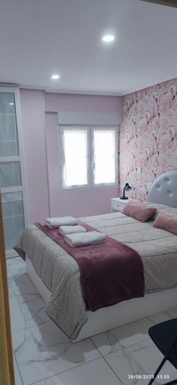 Łóżko lub łóżka w pokoju w obiekcie Apartamento Zona Playa y centro Ciudad