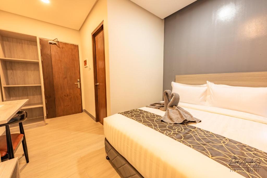 Postel nebo postele na pokoji v ubytování Hotel One