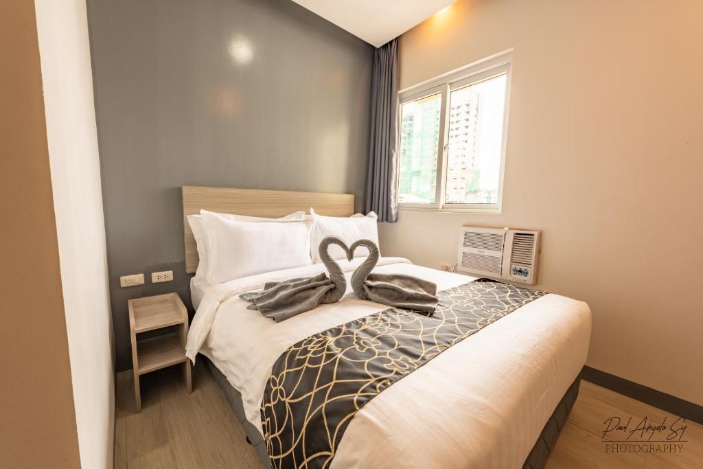 Postel nebo postele na pokoji v ubytování Hotel One